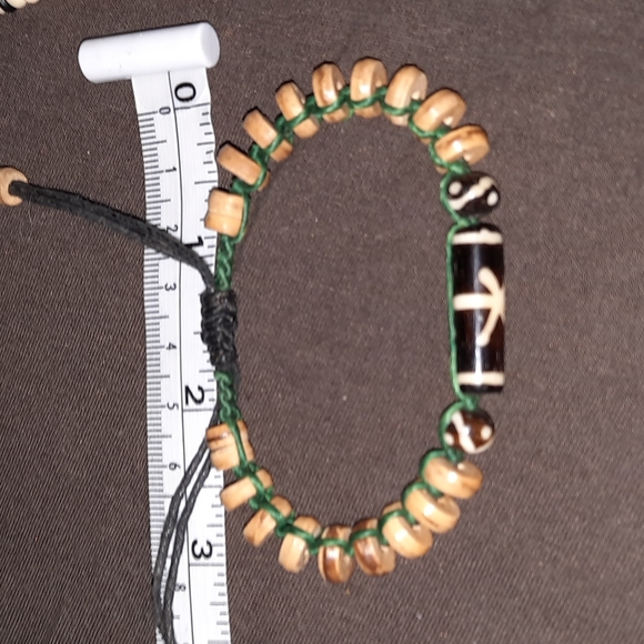 Adjustable wooden boho beaded bracelet on green and brown cord - Picture 3 of 5